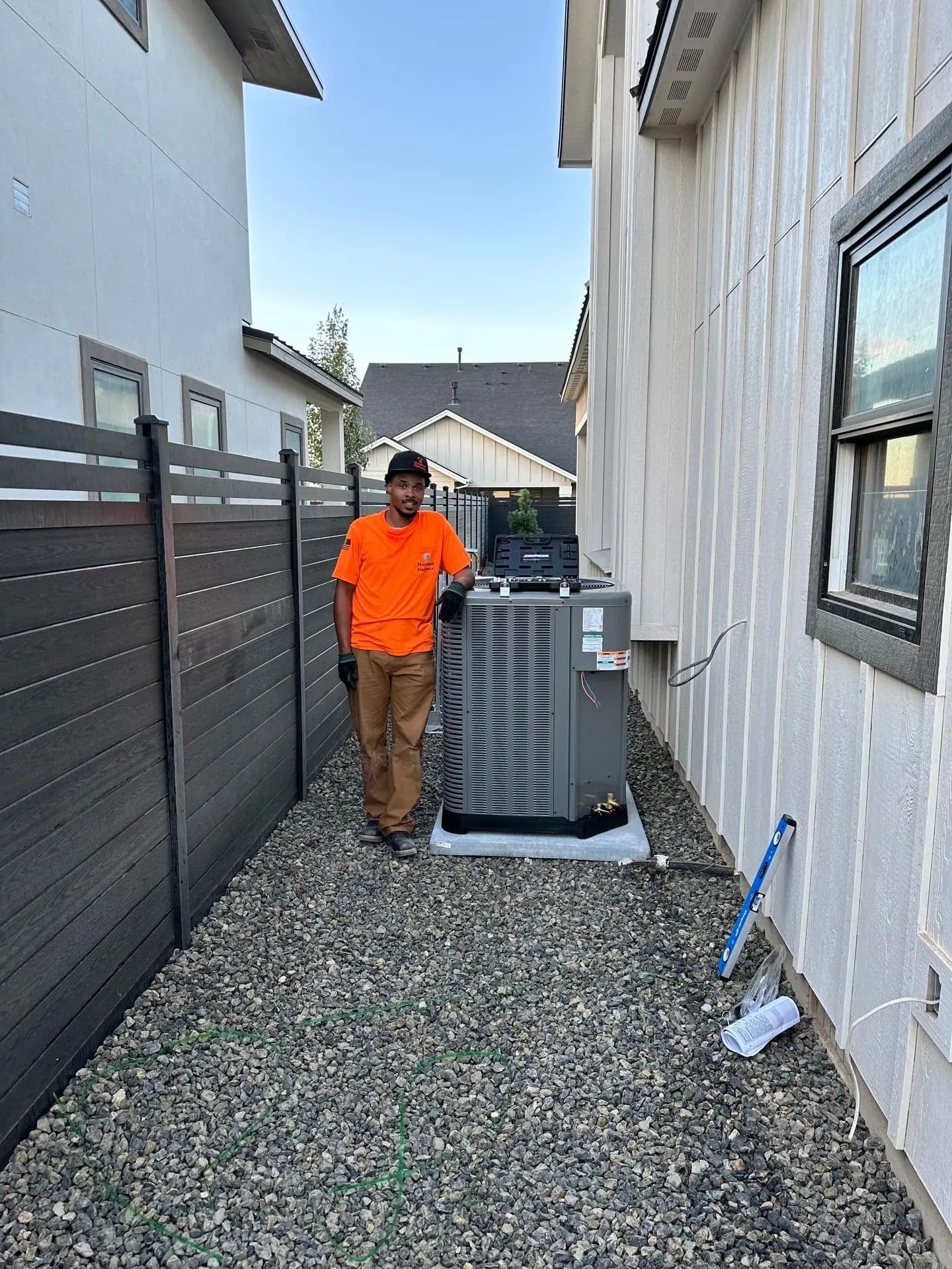 MetalHead Mechanical technician beside a completed condenser install