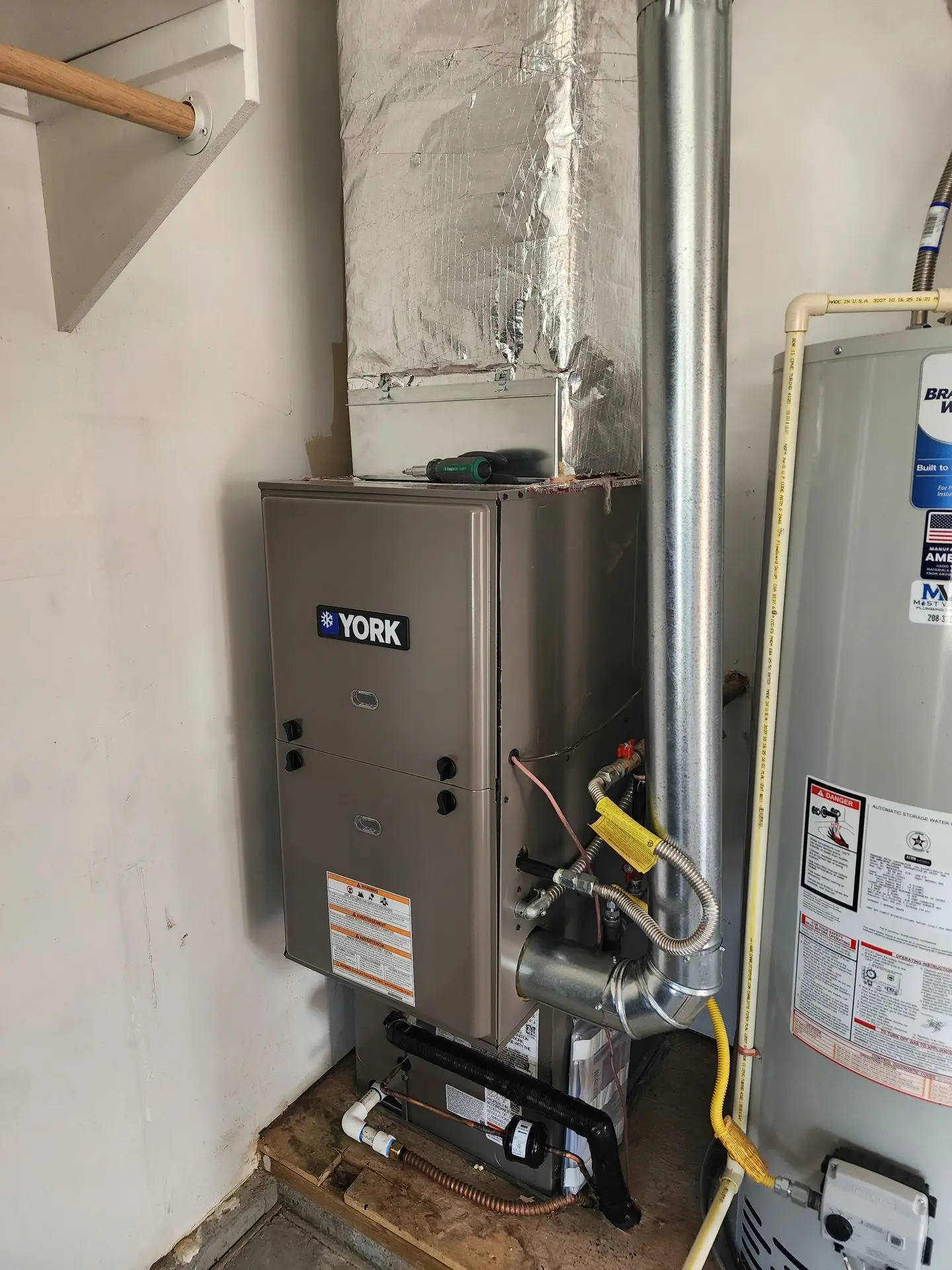 New furnace and water heater with custom sheet metal plenum
