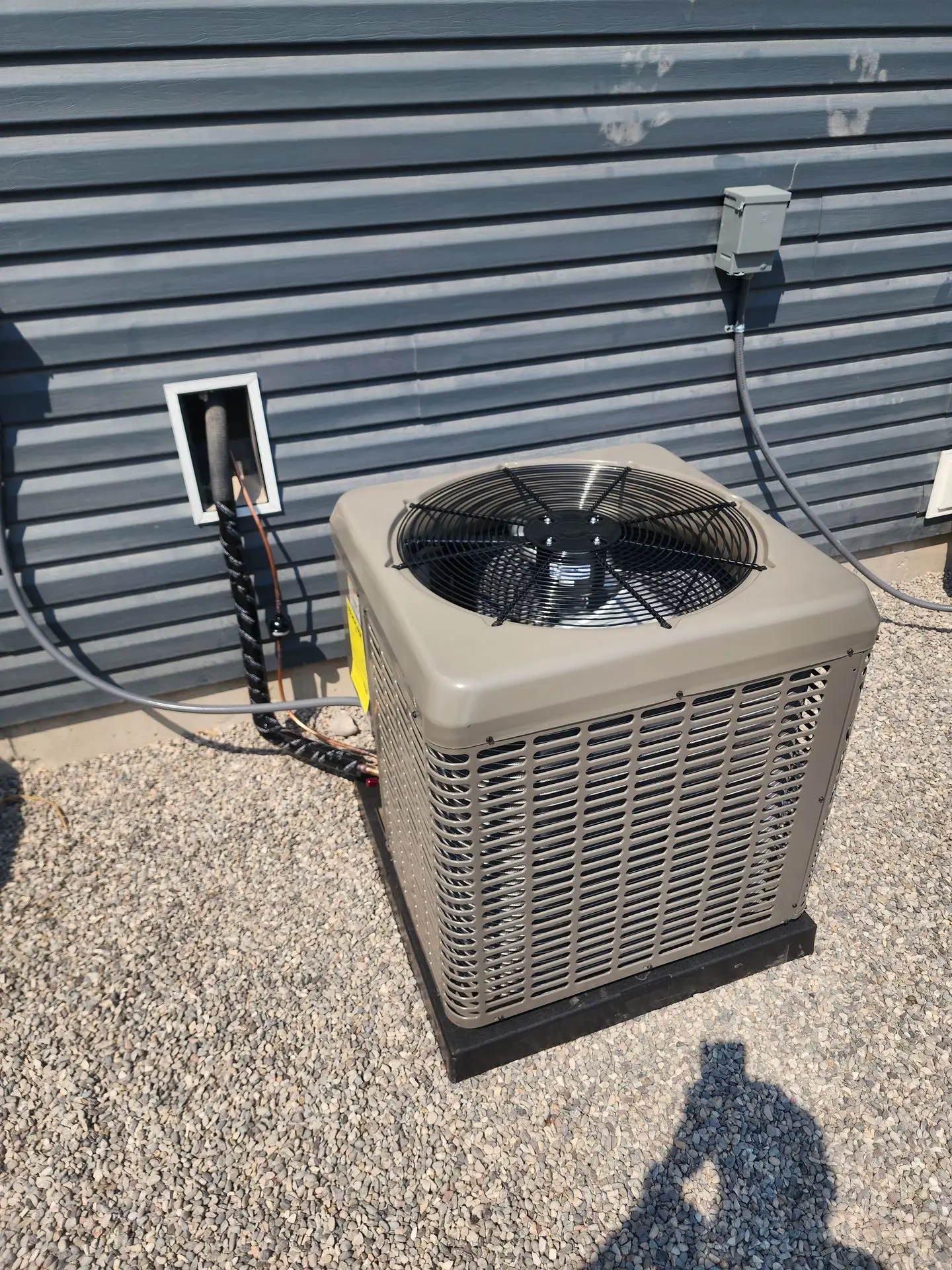 Newly installed condenser on a fresh pad